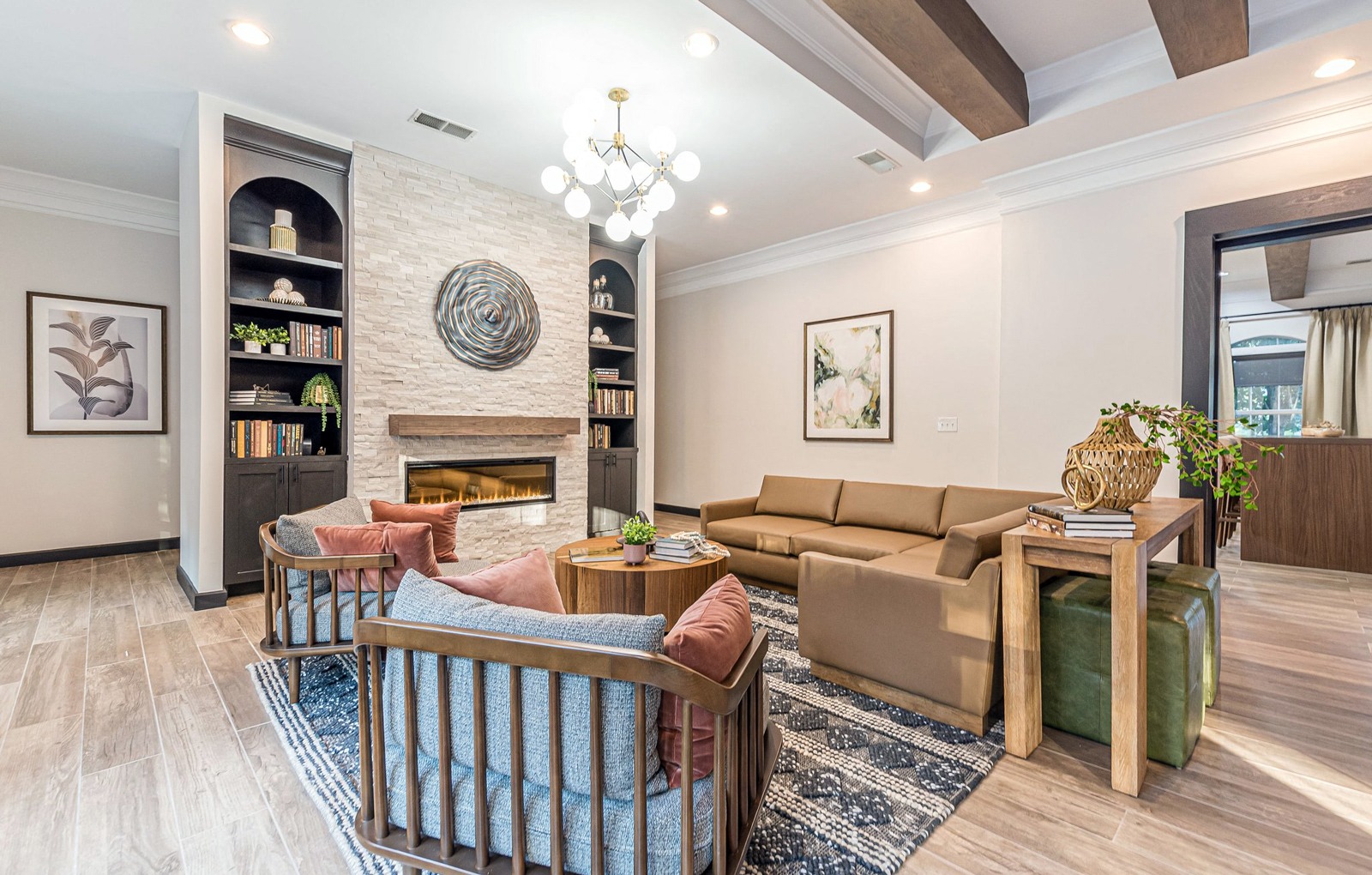 a living room with couches and chairs and a fireplace